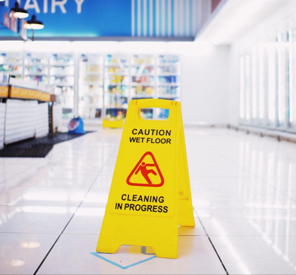 Wet floor sign during a day porter visit for Greater Boston commercial cleaning.
