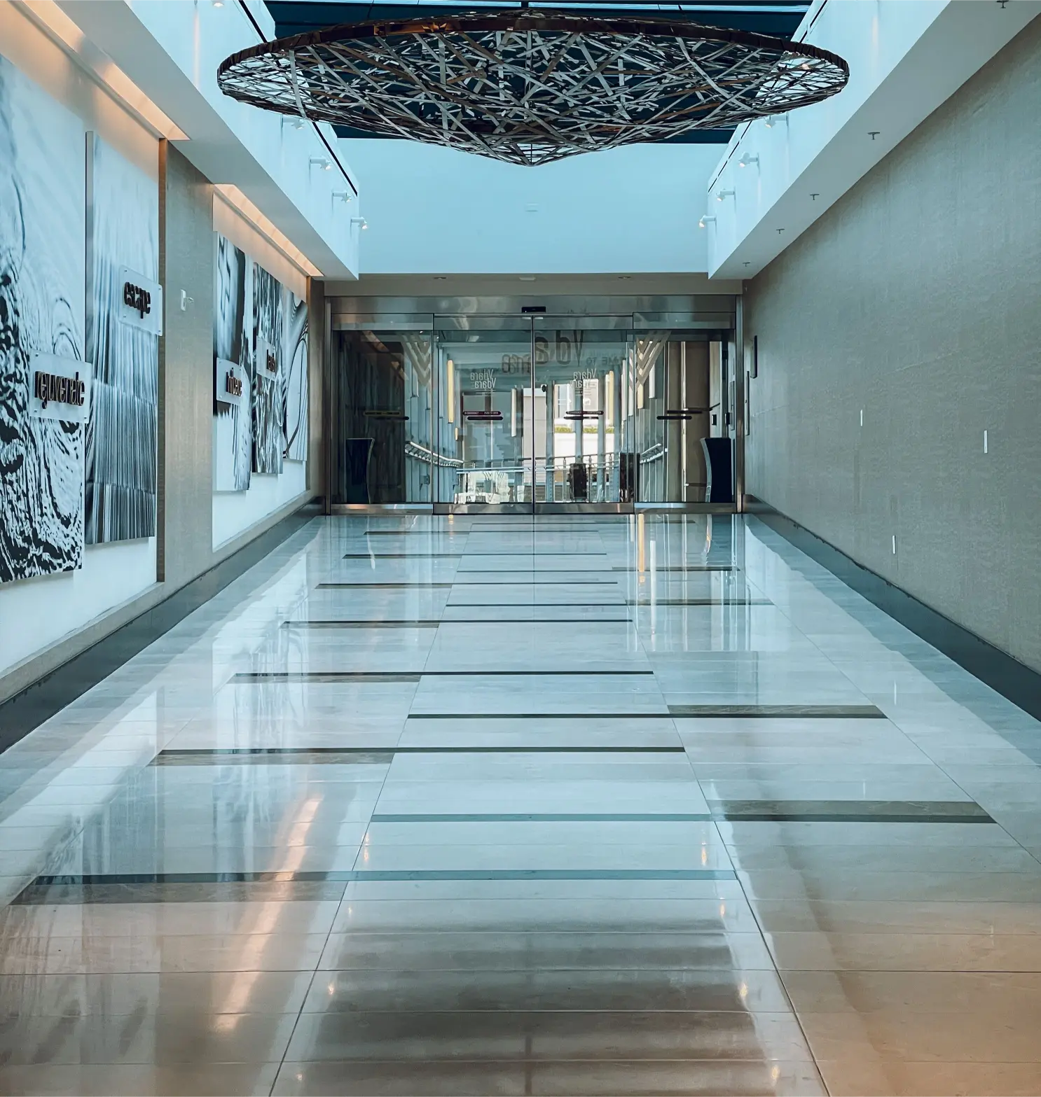 Polished commercial floors in an office corridor maintained by Tully's Cleaning Company's commercial floor cleaning services.