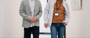 Two owners of an owner-operated commercial cleaning company walking a client's building.